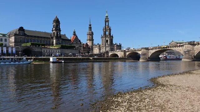 City skyline of Dresden with Dresden Cathedral and Augustus Bridge in the Old Town, view from the shore of Elbe River in Saxony, Germany.