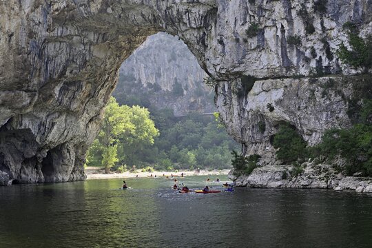 Canoes on the Ard&egrave;che river, above the Pont d'Arc rock gate, Ard&egrave;che Gorge, Gorges de l'Ard&egrave;che, Vallon-Pont-d'Arc, Rh&ocirc;ne-Alpes, France