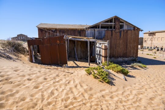 Houses of a former diamond mining town that is slowly sinking into the sands of the Namib Desert, Kolmanskop, Karas, Namibia