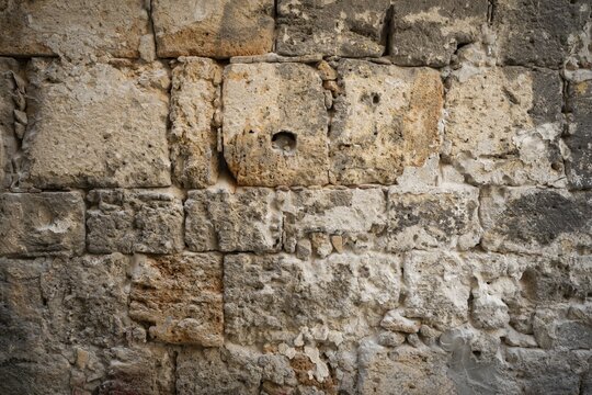 Close-up of a very old stone wall with weathered texture, Palermo, Sicily, Italy