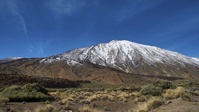 Snowy mountain under clear blue sky, surroundings look barren, Teide, Parque Nacional del Teide, Teide National Park, volcano, volcanism, UNESCO World Heritage Site, Tenerife, Canary Islands, Spain