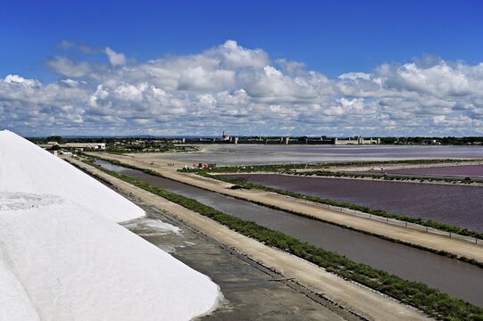 White salt cone, salt marshes, Salins du Midi, behind the historic city wall, Aigues-Mortes, Camargue, southern France, France