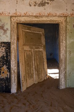 Interior view, doors and house full of sand, former diamond mining town, Namib Desert, Kolmanskop, Karas, Namibia