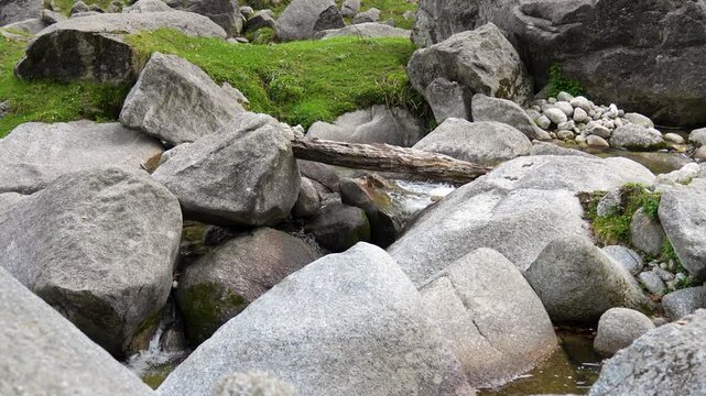 Mountain stream flowing over rocks in kasol, Himachal Pradesh.