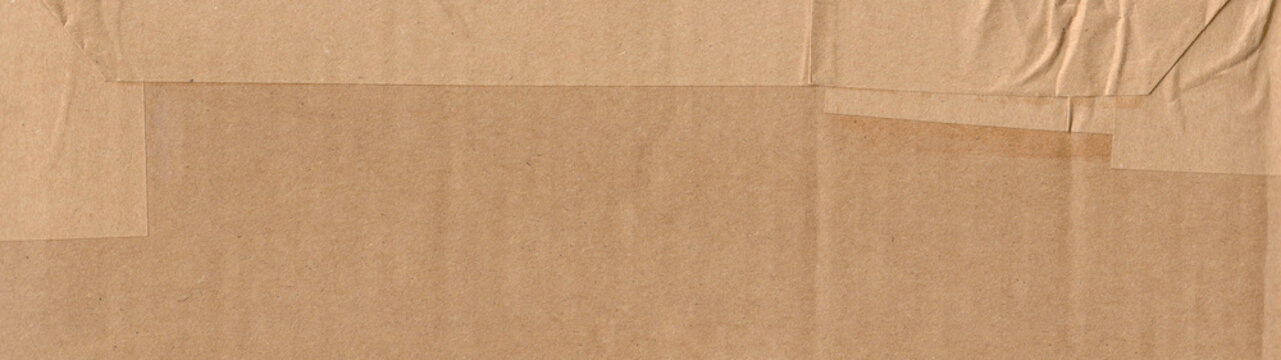 Frame made of brown beige old paper with packet tape, cardboard carton packaging pattern texture background banner panorama