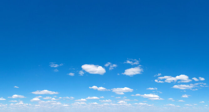 Blue Sky background with tiny Clouds. Panorama background