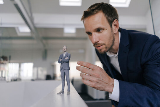Businessman watching his �D portrait