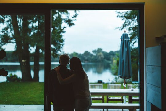 Couple standing together at doorway