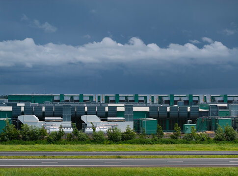 Large data center in Middenmeer Netherlands under dark rainclouds