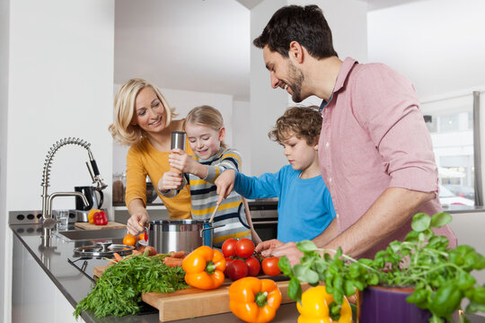 Family cooking in kitchen