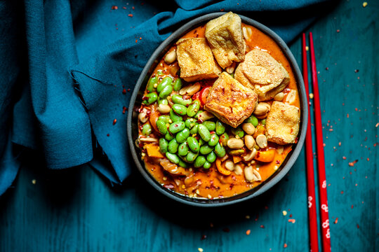 Bowl of ready to eat vegan curry with edamame and tofu