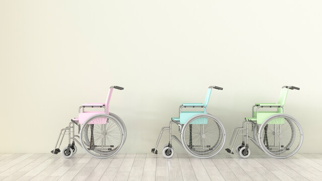 An empty room displays colorful wheelchairs in a row