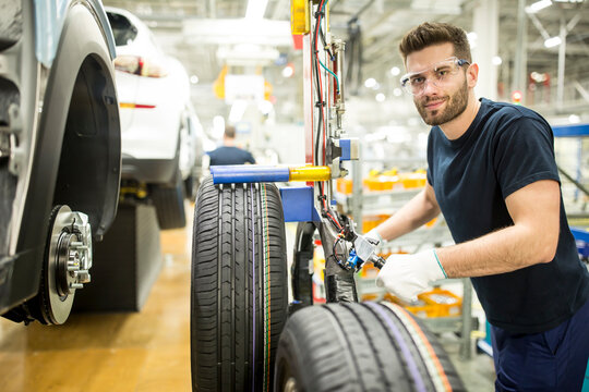 Portrait of confident man working in modern car factory