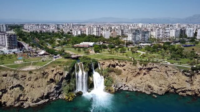 This waterfall plunges directly into the Mediterranean Sea, where limestone cliffs and coastal scenery create a remarkable landscape. Duden Falls, Antalya, Turkey.