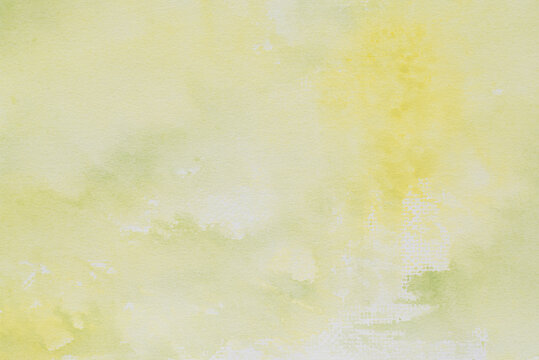 yellow watercolor background painted on paper texture