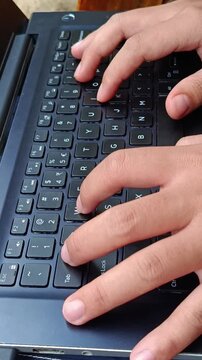Close-up of hands typing on a laptop keyboard, suitable for business, remote work, technology, and productivity concepts.