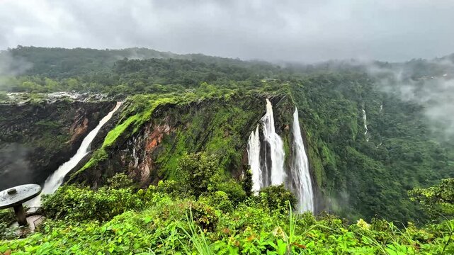 This waterfall flows through a deep rocky gorge, where seasonal monsoon water transforms the surrounding mountain scenery. Jog Falls, Shivamogga, Karnataka, India.