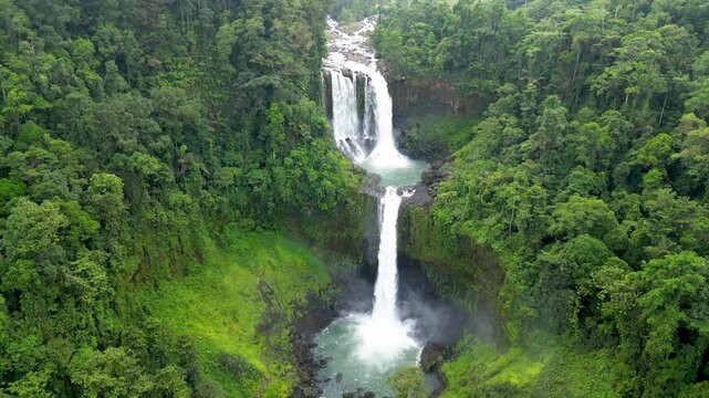 This waterfalls plunge from forested mountains, where the Tagoloan River creates one of the Philippines' highest cascades. Limunsudan Falls, Bukidnon, Philippines.