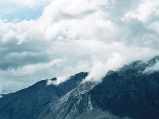 Clouds drifting over a mountain ridge, New Zealand © yichennn