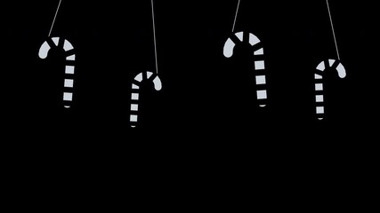 Striped candy canes hanging and swinging from the top edge, silver Christmas transparent overlay, seamless loop animation