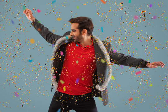 Young man dancing at a new year eve party. 