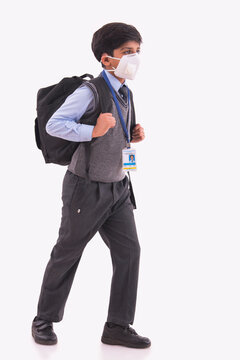 Portrait of a young boy going to school wearing a pollution mask.(Children)