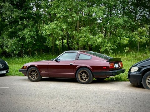 Classic sports car is a second-generation Nissan (Datsun) 280ZX (S130 generation), produced between 1978 and 1983. A maroon Nissan Datsun 280ZX (S130 generation), produced between 1978 and 1983