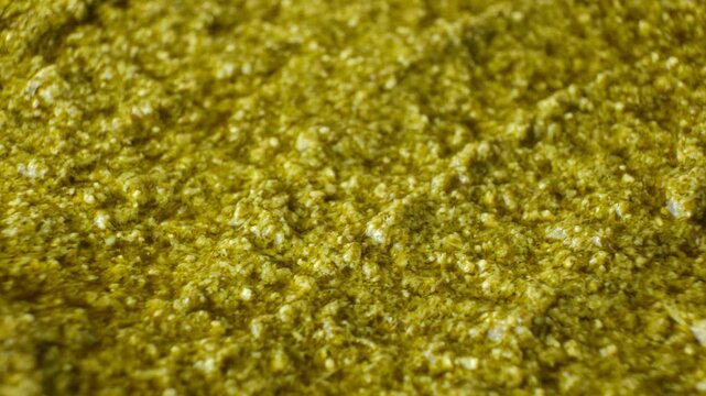 Traditional Italian basil pesto background slow rotating