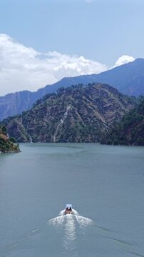 Vertical Aerial View of Chamera Lake with Speedboat, Himachal Pradesh, India