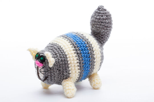 A crocheted cat toy on a white background