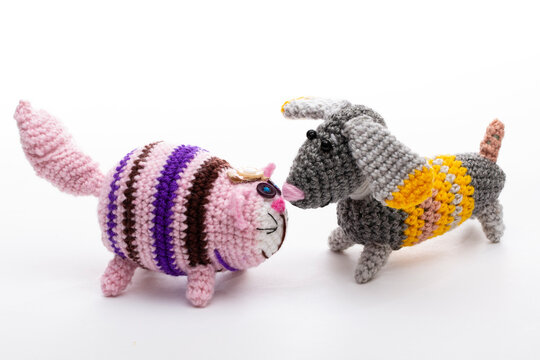 A crocheted cat toy on a white background