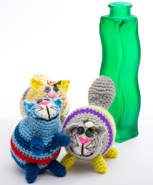 A crocheted cat toy on a white background