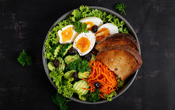 Mediterranean Style Breakfast Bowl with Salad and Bread. Top view, above