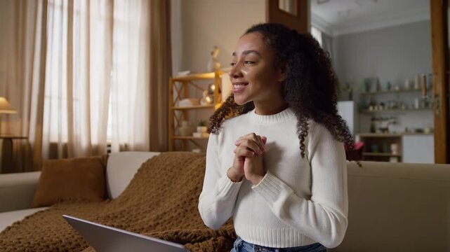 Woman Anticipating Good News on Laptop
