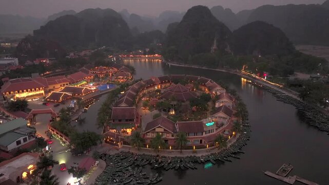Aerial view of Tam Coc, a Historic Old Town Island in evening, Surrounded by Carst Mountains in Ninh Binh, Vietnam.