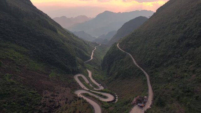 Aerial View Of the Winding Tham Ma Mountain Pass In Ha Giang Province In Vietnam - Ha Giang Loop Drone Shot at Sunset.