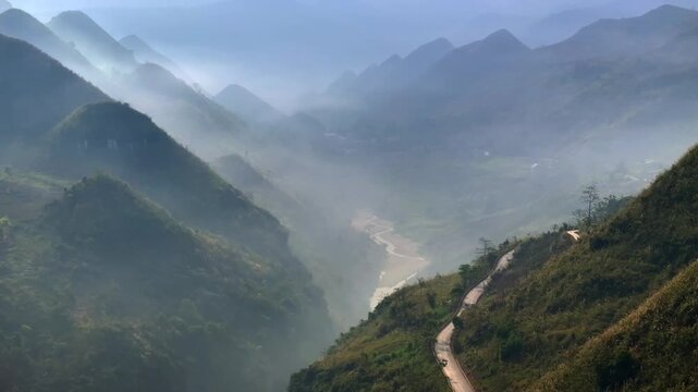 Ha Giang Loop. Picturesque curvy Mountain Road in North Vietnam. Beautiful Misty Carst Mountains, UNESCO world heritage.