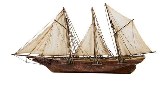 Wooden sailing ship model with three masts and sails