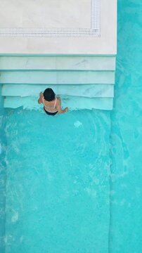 Aerial View Woman Exiting Luxury Pool Stairs Halkidiki Greece