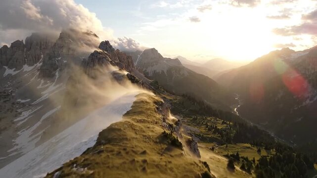 Sunset over Misty Dolomites Mountain Ridge