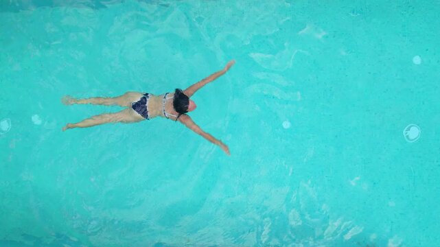 Woman Swimming in Luxury Villa Pool Aerial View Halkidiki