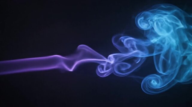 High-speed visualization of colorful smoke trails forming intricate swirling patterns and wisps against dark background