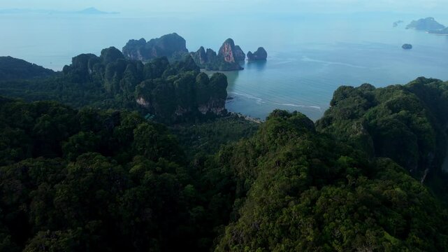 Aerial view of crystal clear water and beautiful tropical coastline in Krabi, Thailand.
