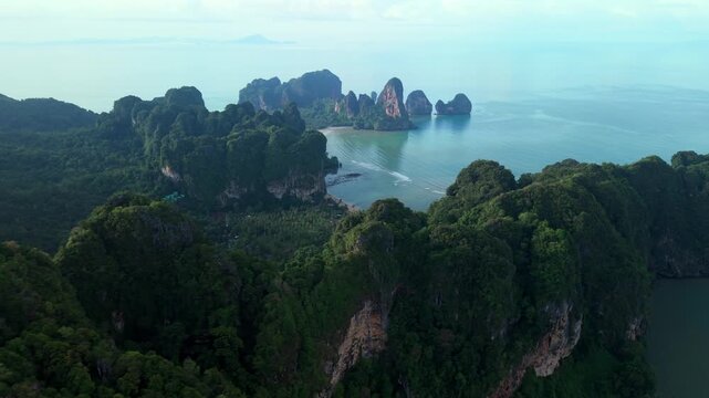 Aerial view of crystal clear water and beautiful tropical coastline in Krabi, Thailand.