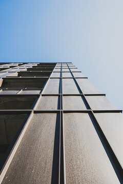 Modern skyscraper facade with metal panels and glass windows