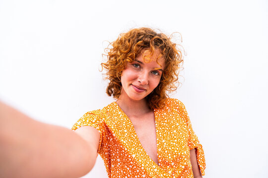 Portrait of cheerful and beautiful young girl with red hair