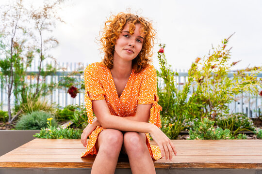 Portrait of cheerful and beautiful young girl with red hair