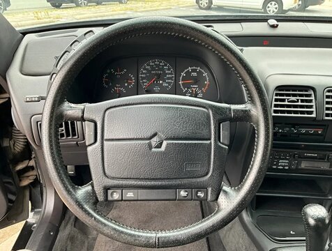 Chrysler LeBaron interior showing dashboard and steering wheel