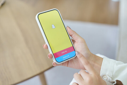 CHIANG MAI, THAILAND, JUL 23 2026 : Snapchat application icon on Apple iPhone smartphone screen close-up in woman hands. Snapchat app icon. Social media icon. Social network