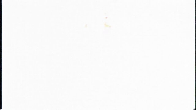 A red pushpin on a white background slowly moves and rotates.